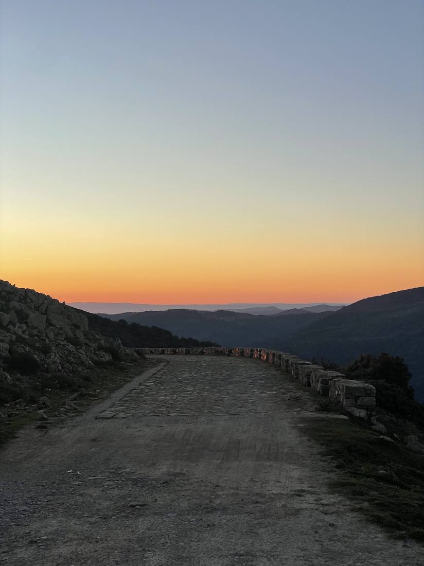 A dry stone walled track at dusk
