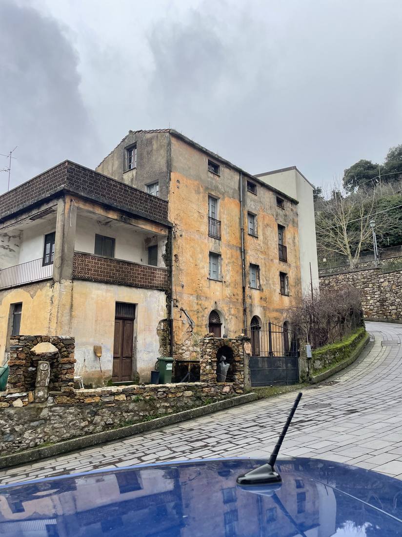 A large derelict building on a corner